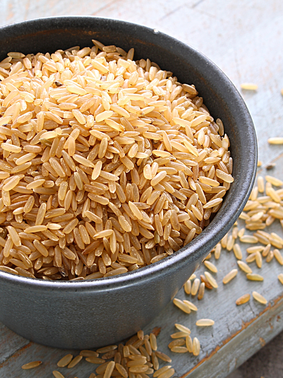 A bowl of raw brown rice.