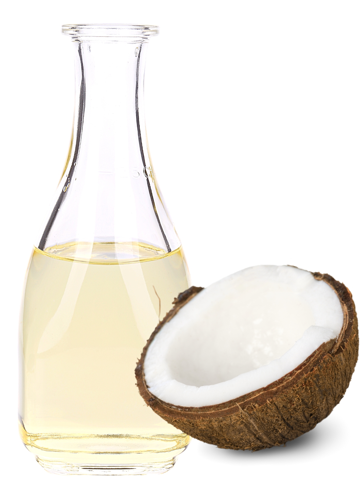 A bottle of raw organic clear coconut vinegar with a half open coconut in a shell next to it.