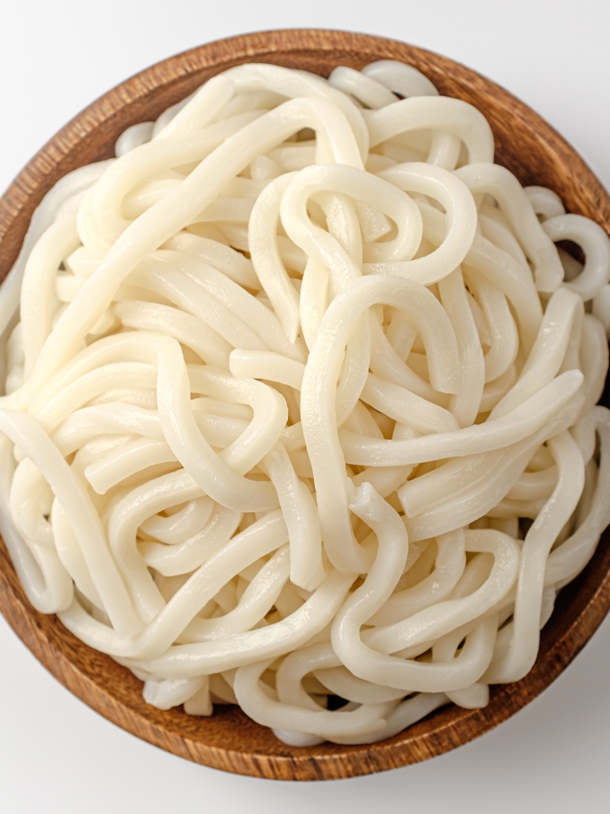 Boiled Udon Noodles in a wooden bowl.