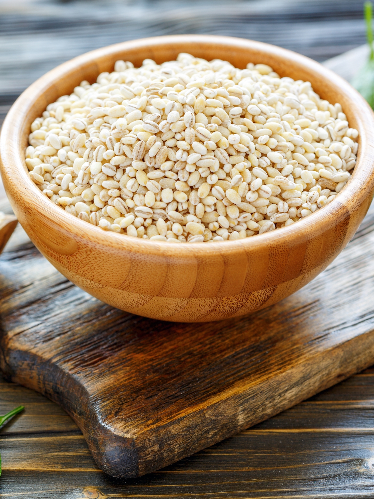 Pearl barley in a wooden bowl.