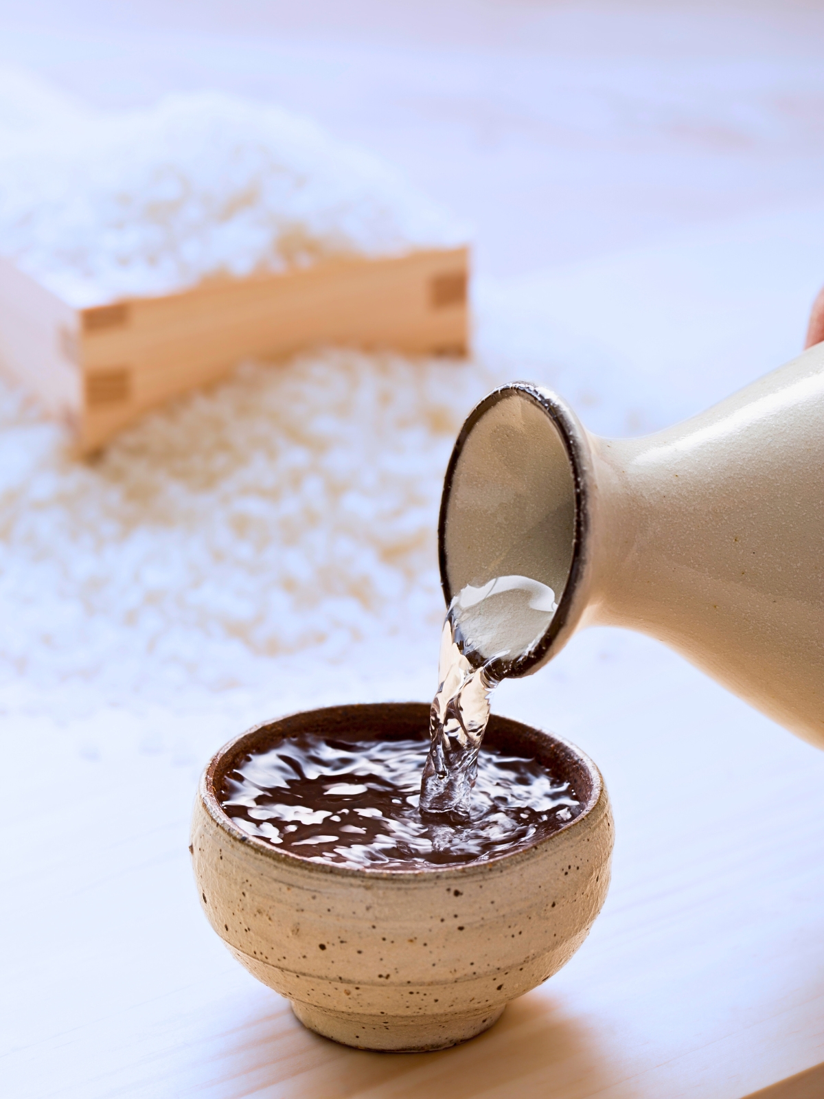 Sake poured into a ceramic bowl.