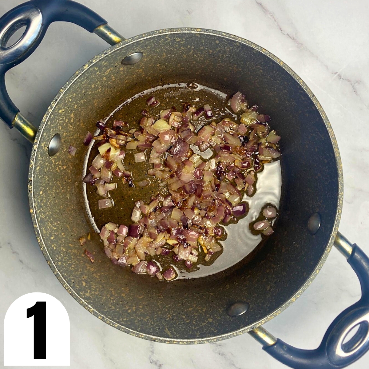 Sauteed onions and olive oil in a saucepan.