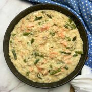 Smoked salmon asparagus risotto in a pan.