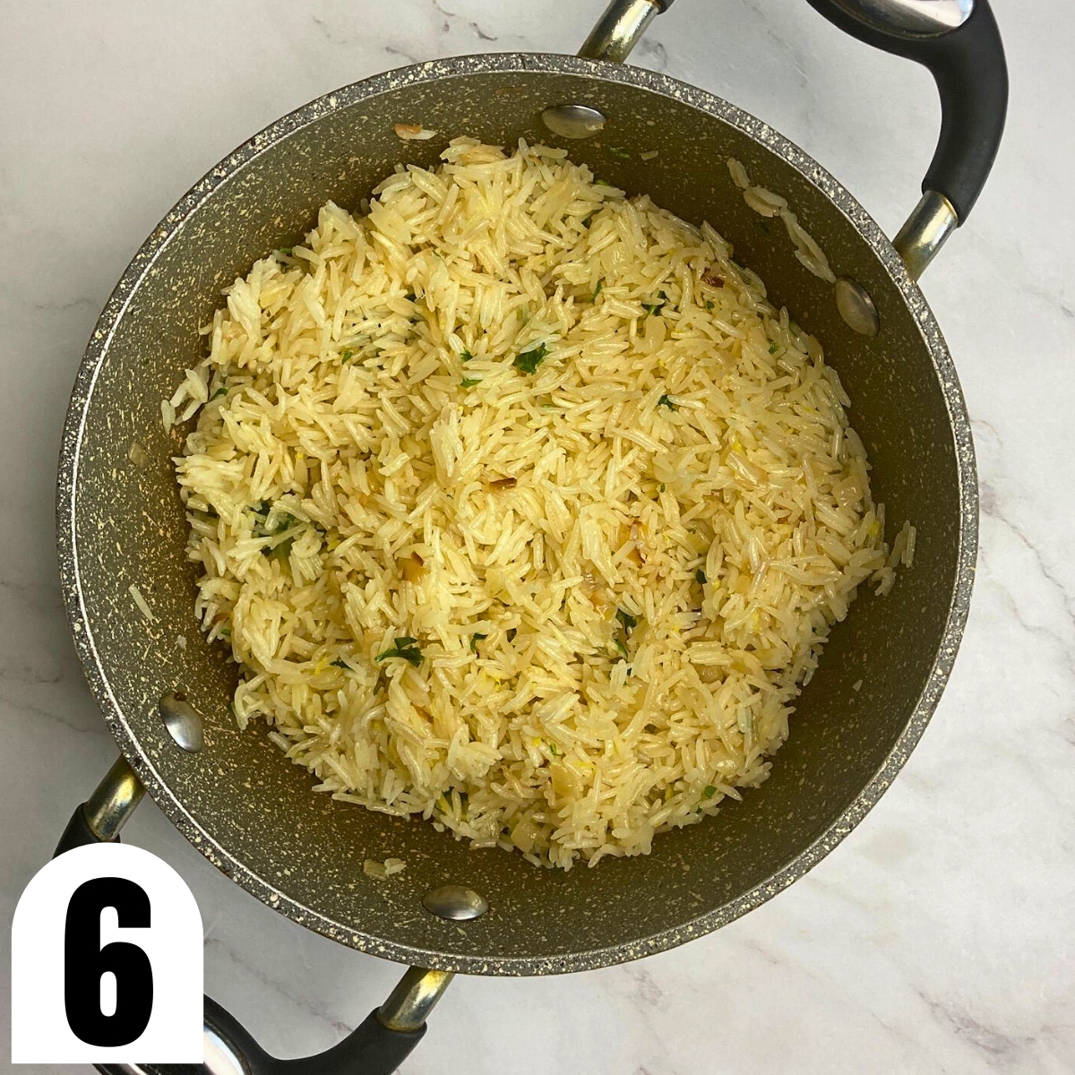 Lemon rice pilaf in stone saucepan.