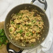 Risotto with shiitake mushrooms and tahini in a stone saucepan.