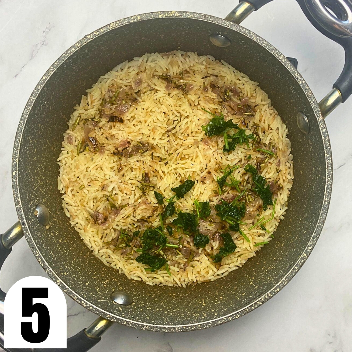 Saucepan with herbed rice pilaf with parsley on top.
