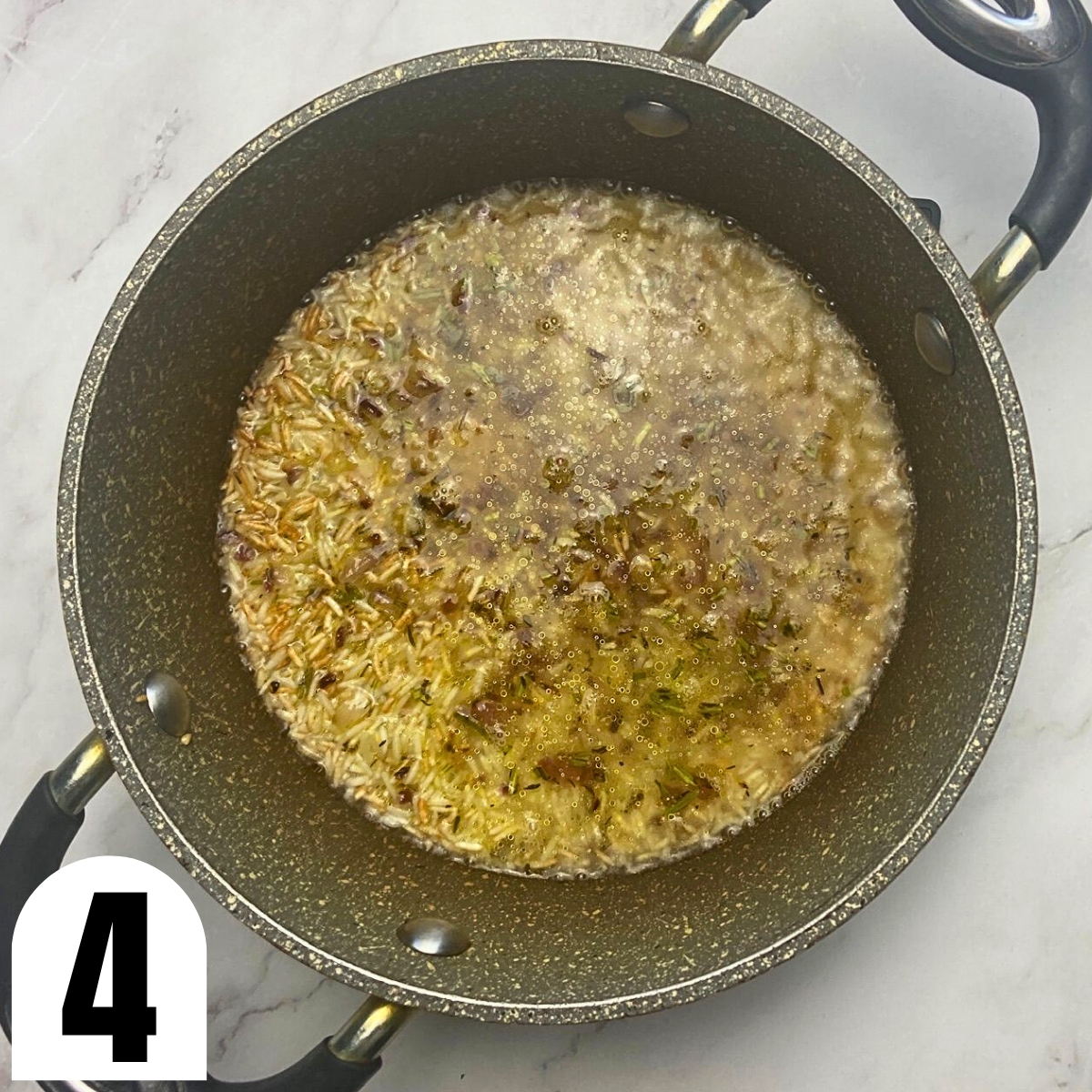 Saucepan with herbed rice pilaf and water.