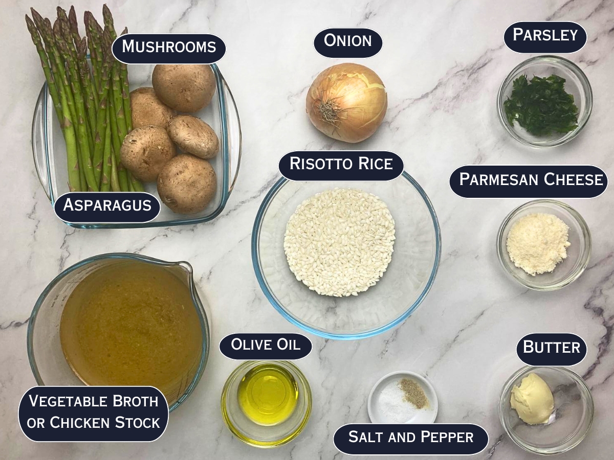 Ingredients needed to prepare mushroom and asparagus risotto displayed on a marble countertop.